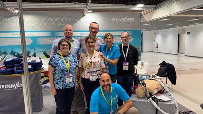 WEINMANN team in front of the booth