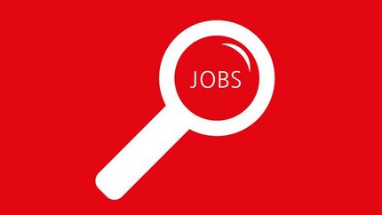 Find the right job for you! Magnifying glass on red background