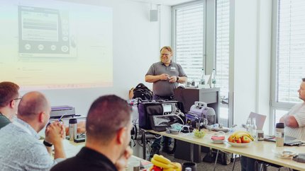 WEINMANN application specialist explains digital device during a practical training