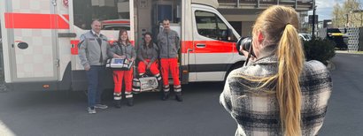 Working student takes photos of a rescue team